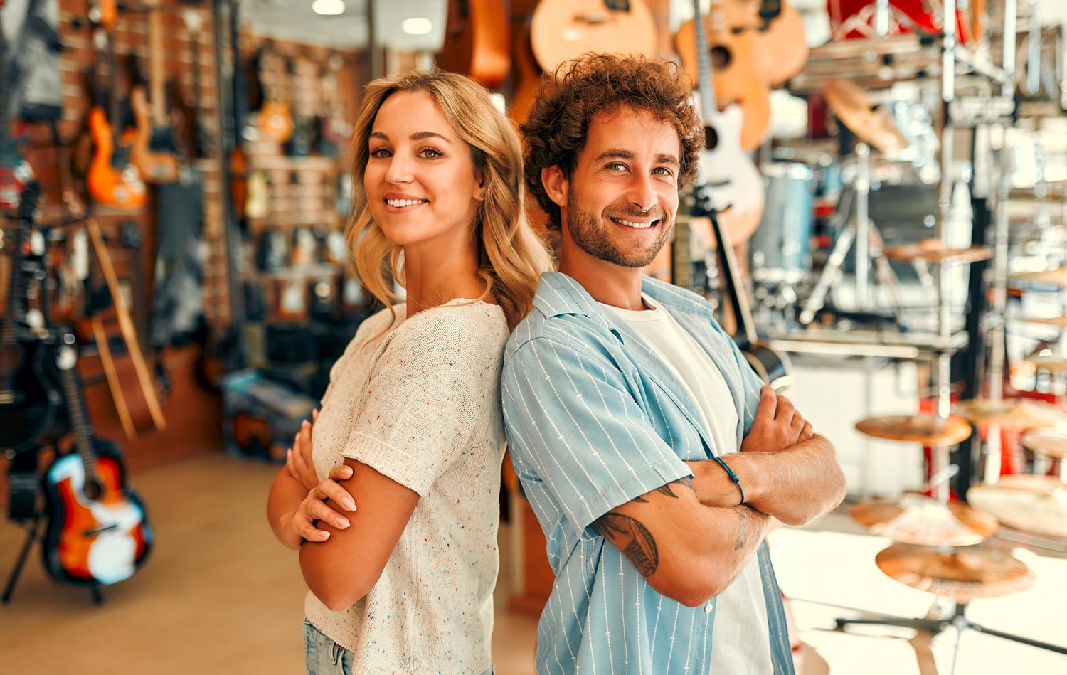 Two people stood in a music shop