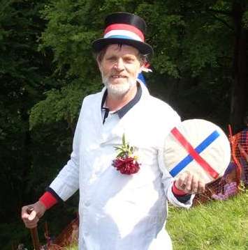 A cheesemaster at the cheese rolling competition