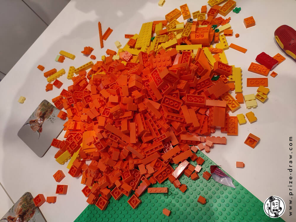 Pile of orange and yellow lego bricks that went into the pumpkin