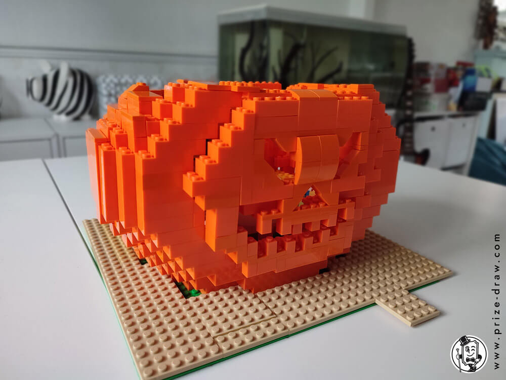 Close side view of pumpkin lego head